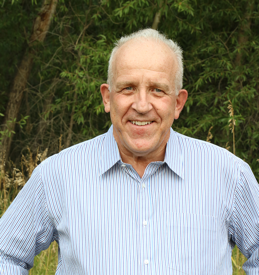 Tom Griggs in a blue striped shirt